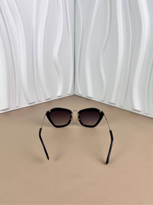 Miu Miu Black Cat-Eye Sunglasses with Gold Arms
