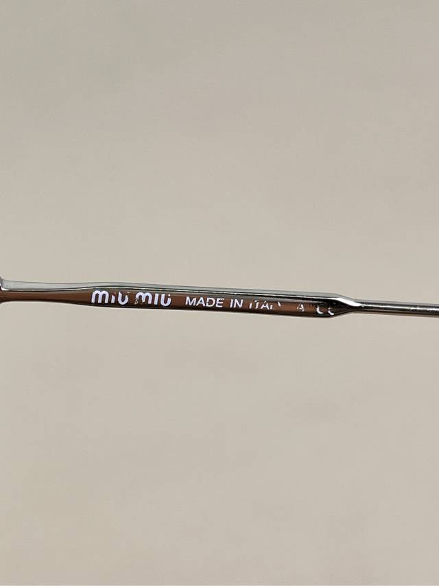 Miu Miu Black Cat-Eye Sunglasses with Gold Arms