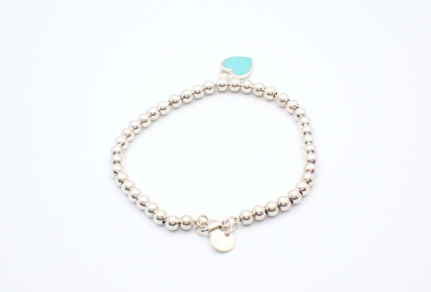 Tiffany & Co. Sterling Silver Bead Bracelet with Turquoise Heart Charm