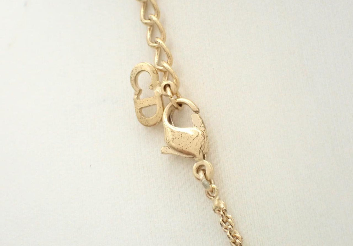 Dior gold necklace with rhinestone heart and CD monogram pendant