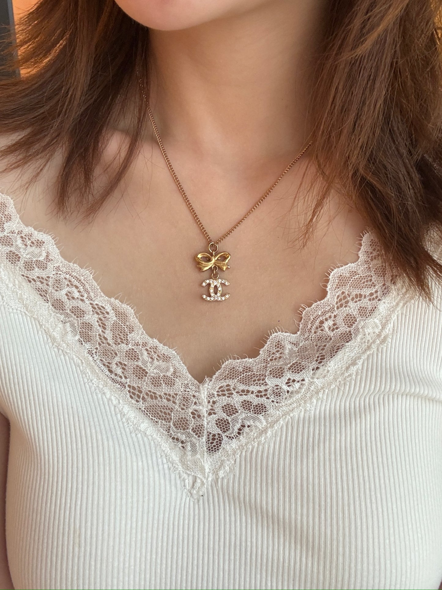 Chanel 2006 Plated Gold Crystal CC Bow Pendant Necklace