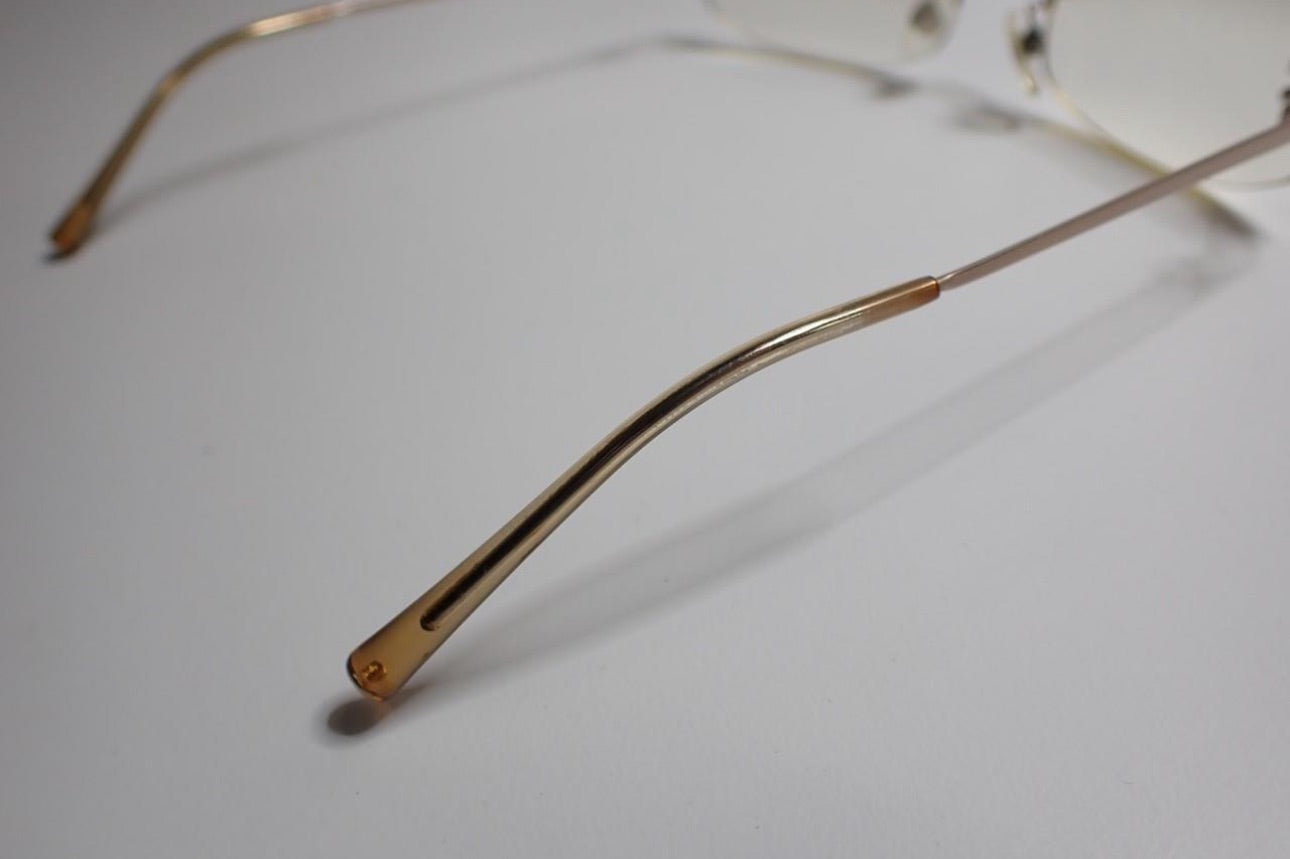 Chanel Rimless Rectangle Eyeglasses – Champagne Silver Tone