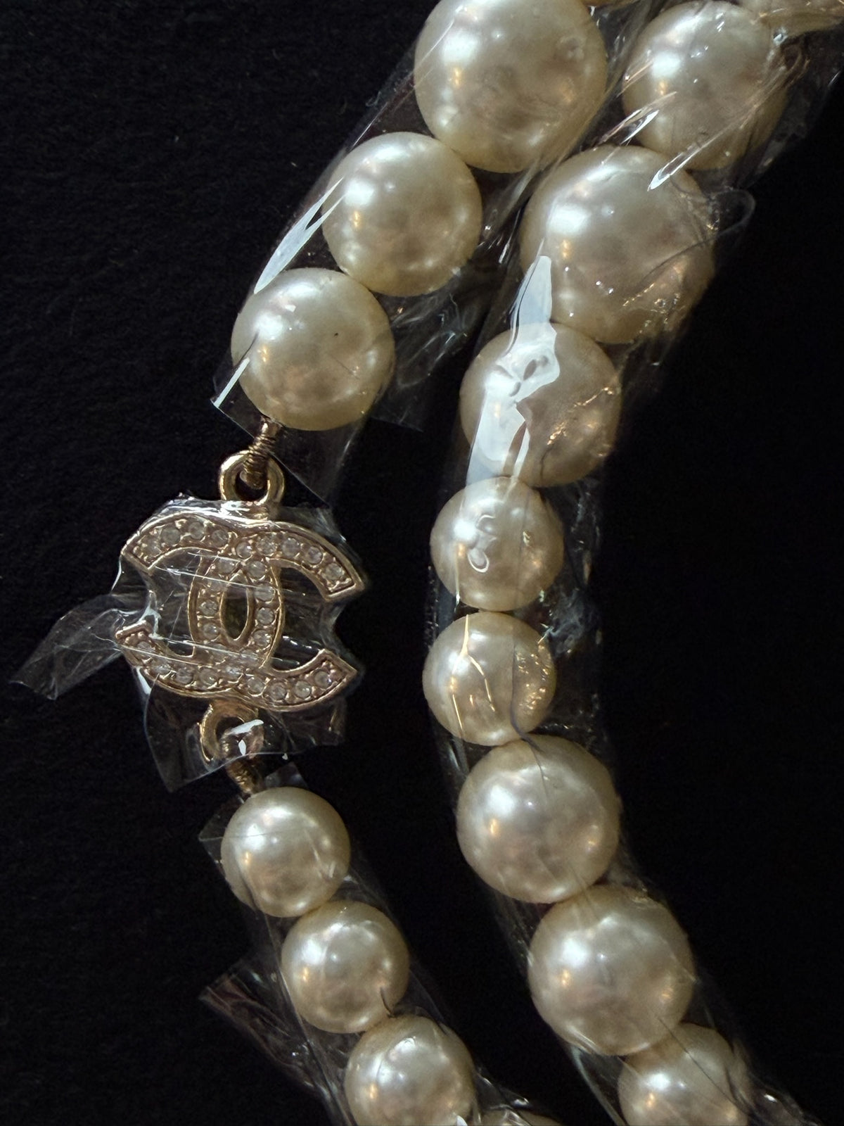 CHANEL Classic Faux Pearl
Crystal CC Long Necklace