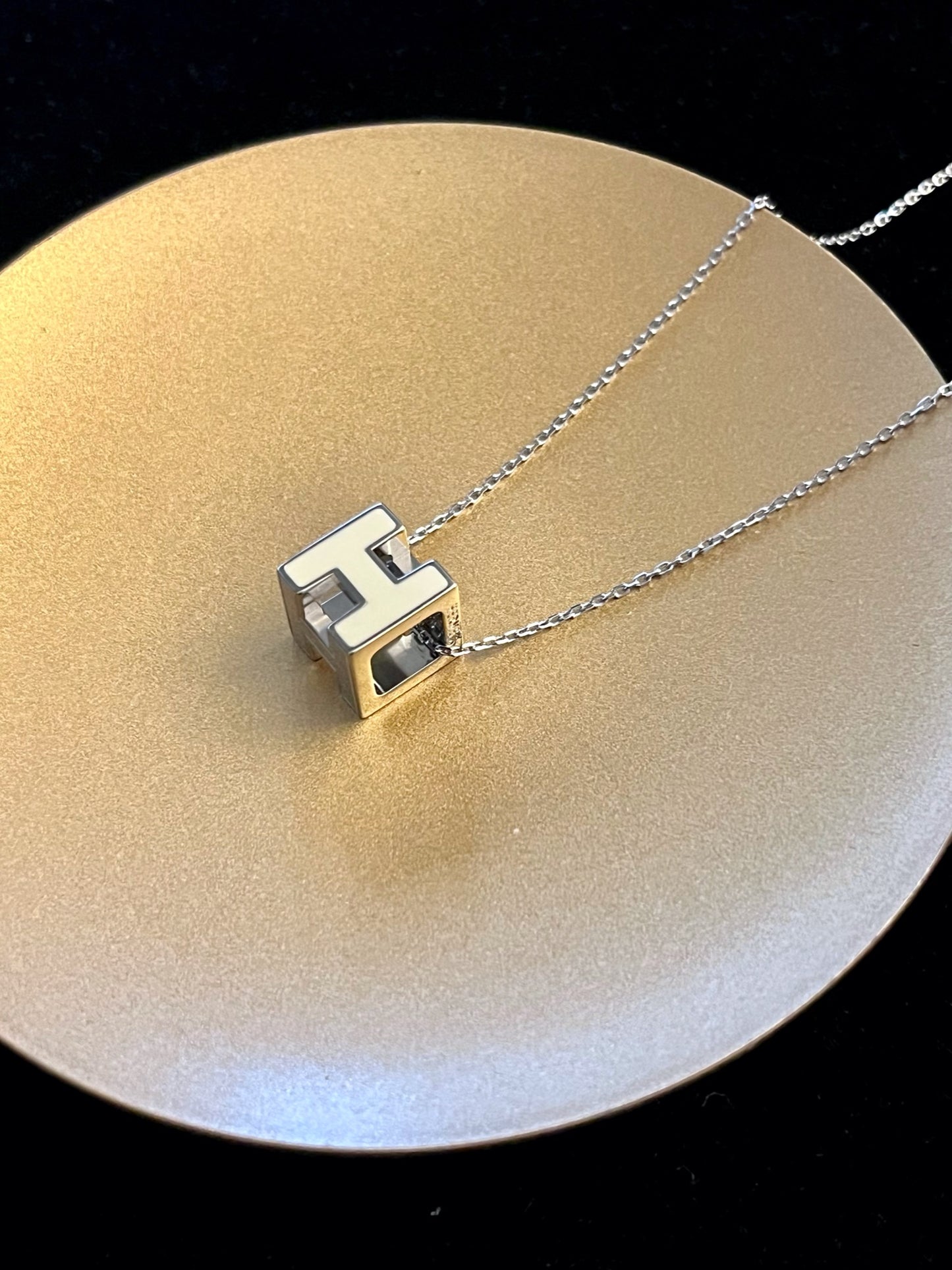 Hermès H Cube Pendant Necklace – White & Silver Tone