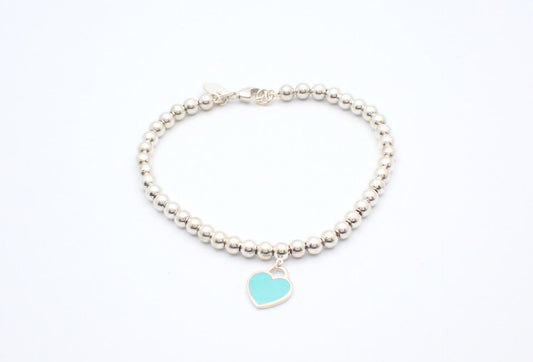 Tiffany & Co. Sterling Silver Bead Bracelet with Turquoise Heart Charm