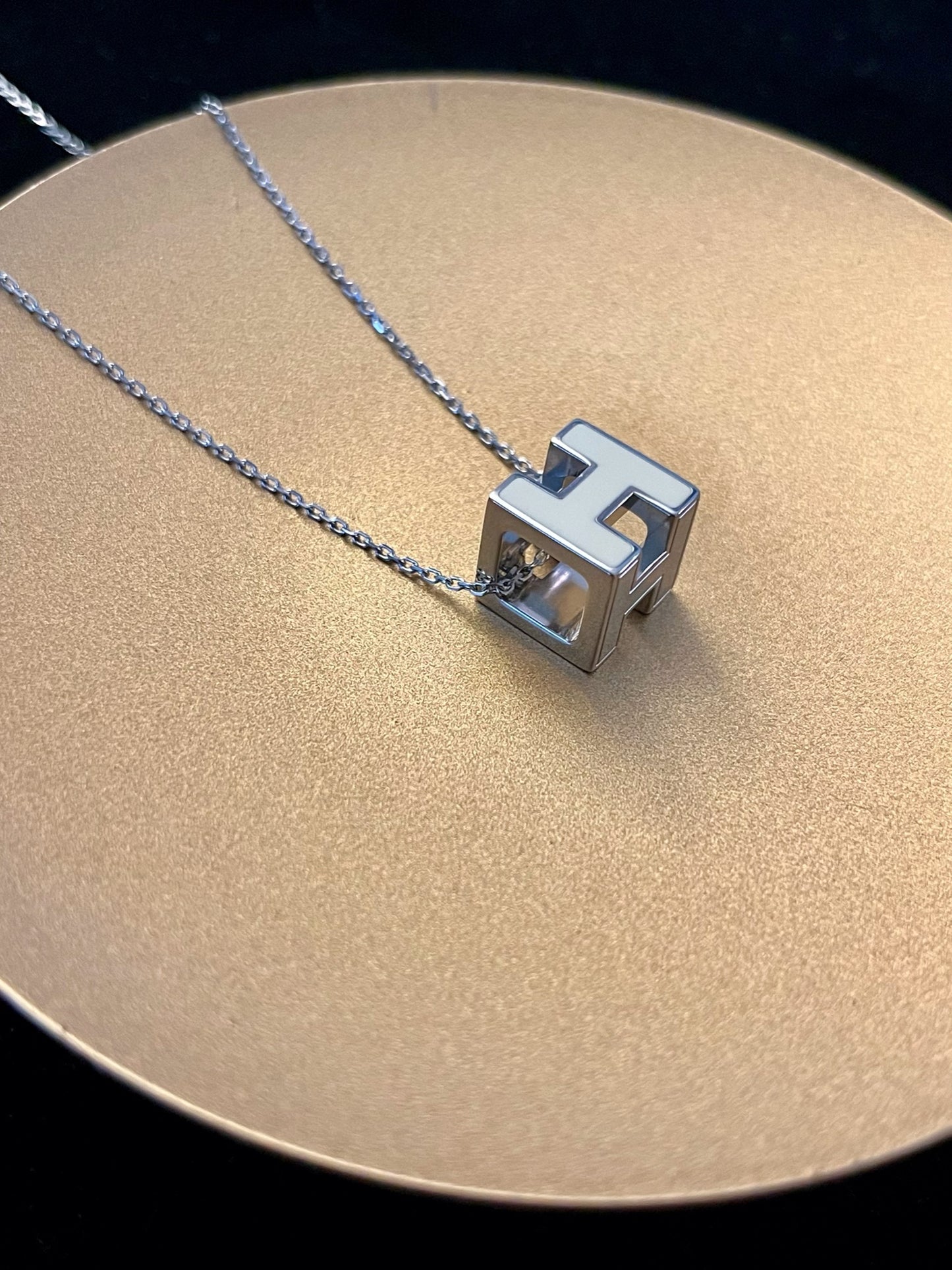 Hermès H Cube Pendant Necklace – White & Silver Tone