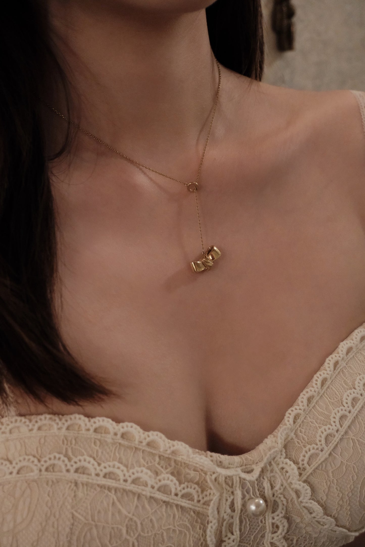 Dior Gold Bow Pendant Necklace with Pink Logo Charm