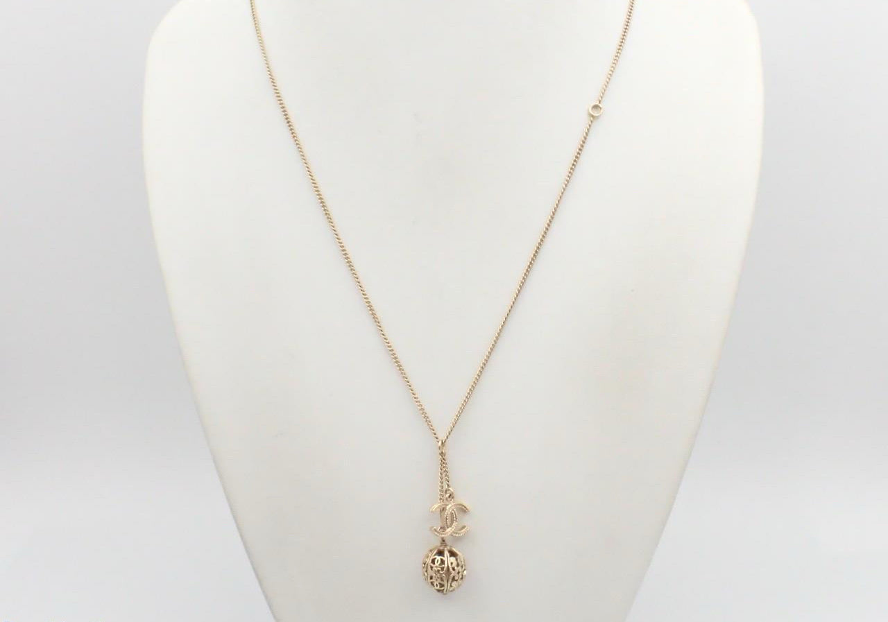 Chanel 2006 Champagne-Gold Filigree Sphere & CC Charm Necklace