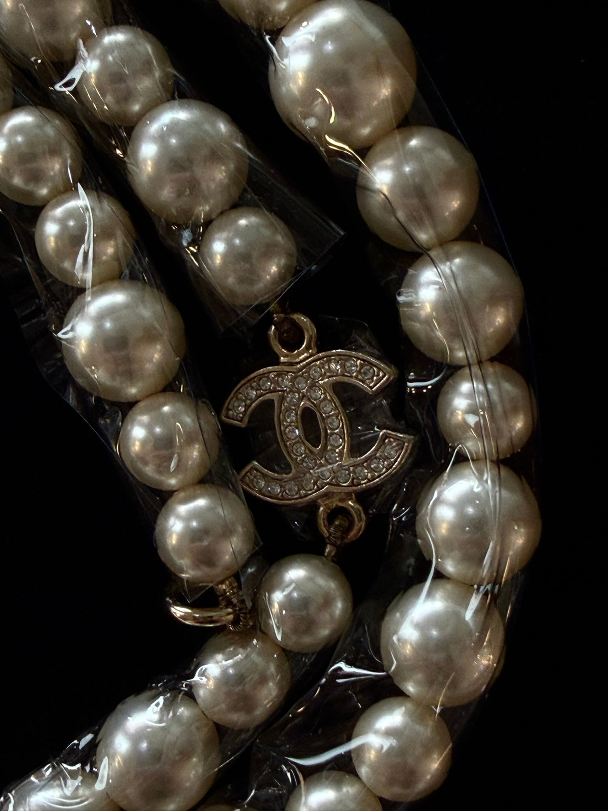 CHANEL Classic Faux Pearl
Crystal CC Long Necklace