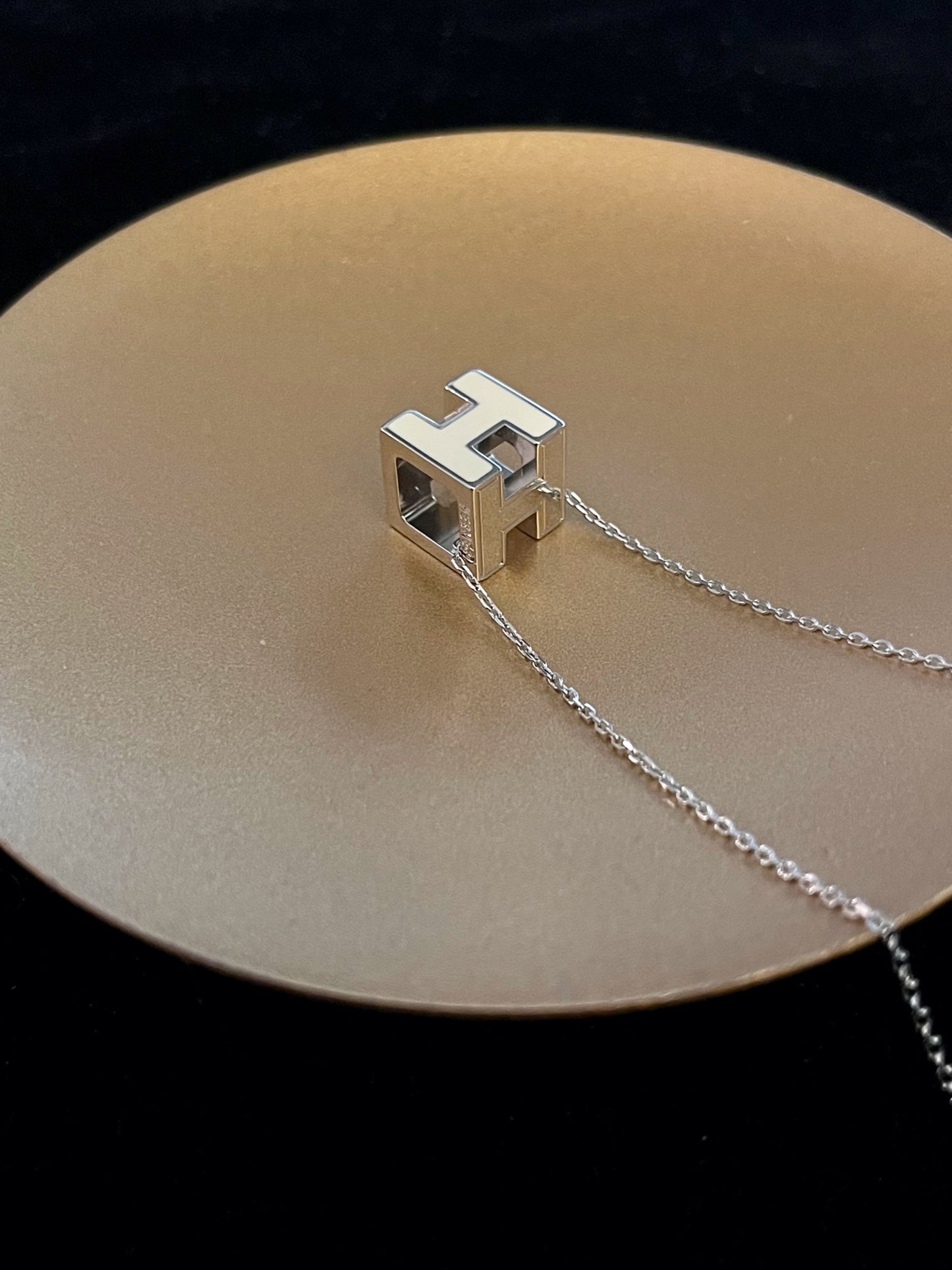 Hermès H Cube Pendant Necklace – White & Silver Tone
