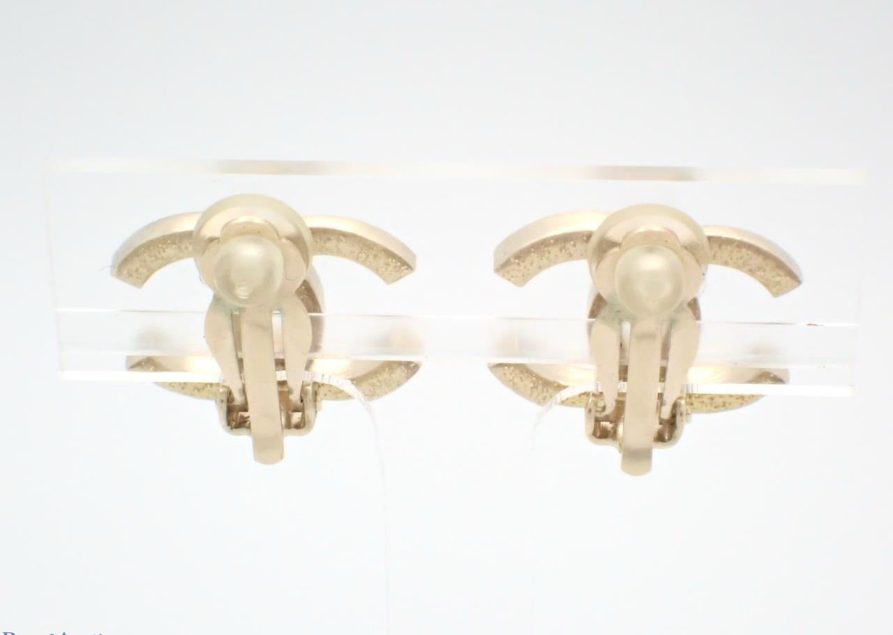Chanel 2012 Vintage Gold-Tone Double C Pink & Royal purple Crystal Ear Clips