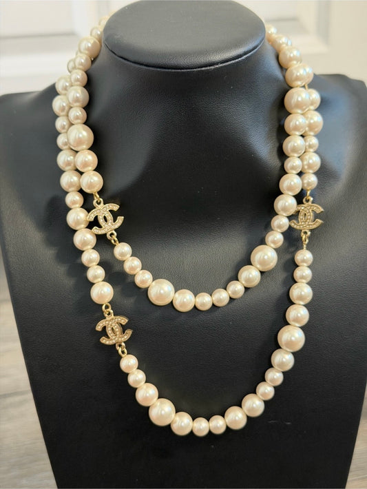 CHANEL Classic Faux Pearl
Crystal CC Long Necklace
