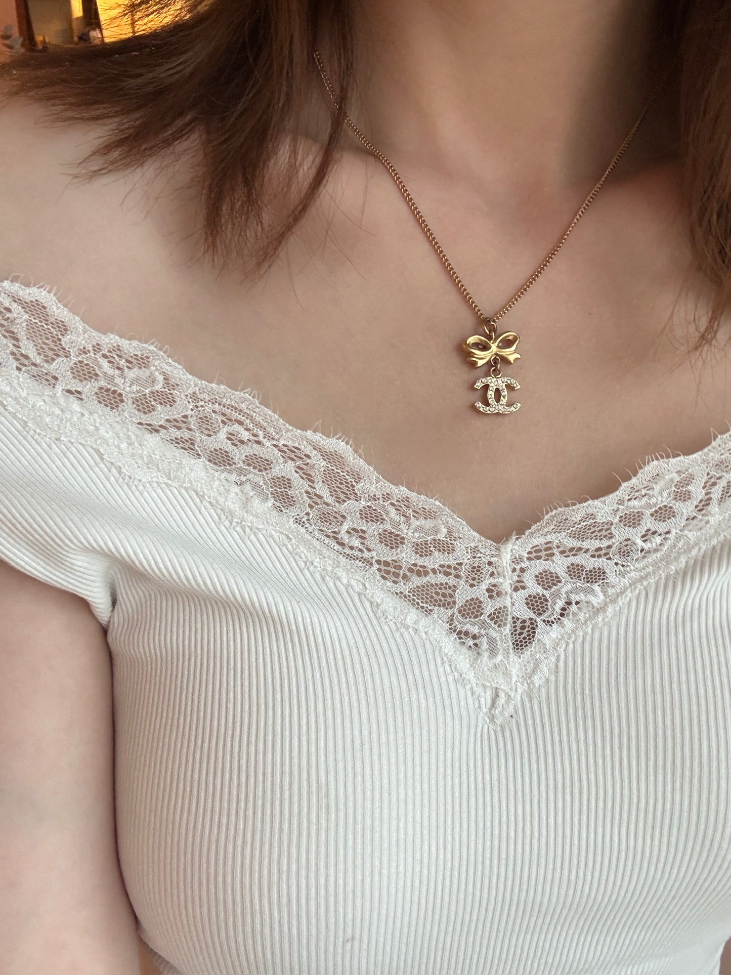 Chanel 2006 Plated Gold Crystal CC Bow Pendant Necklace
