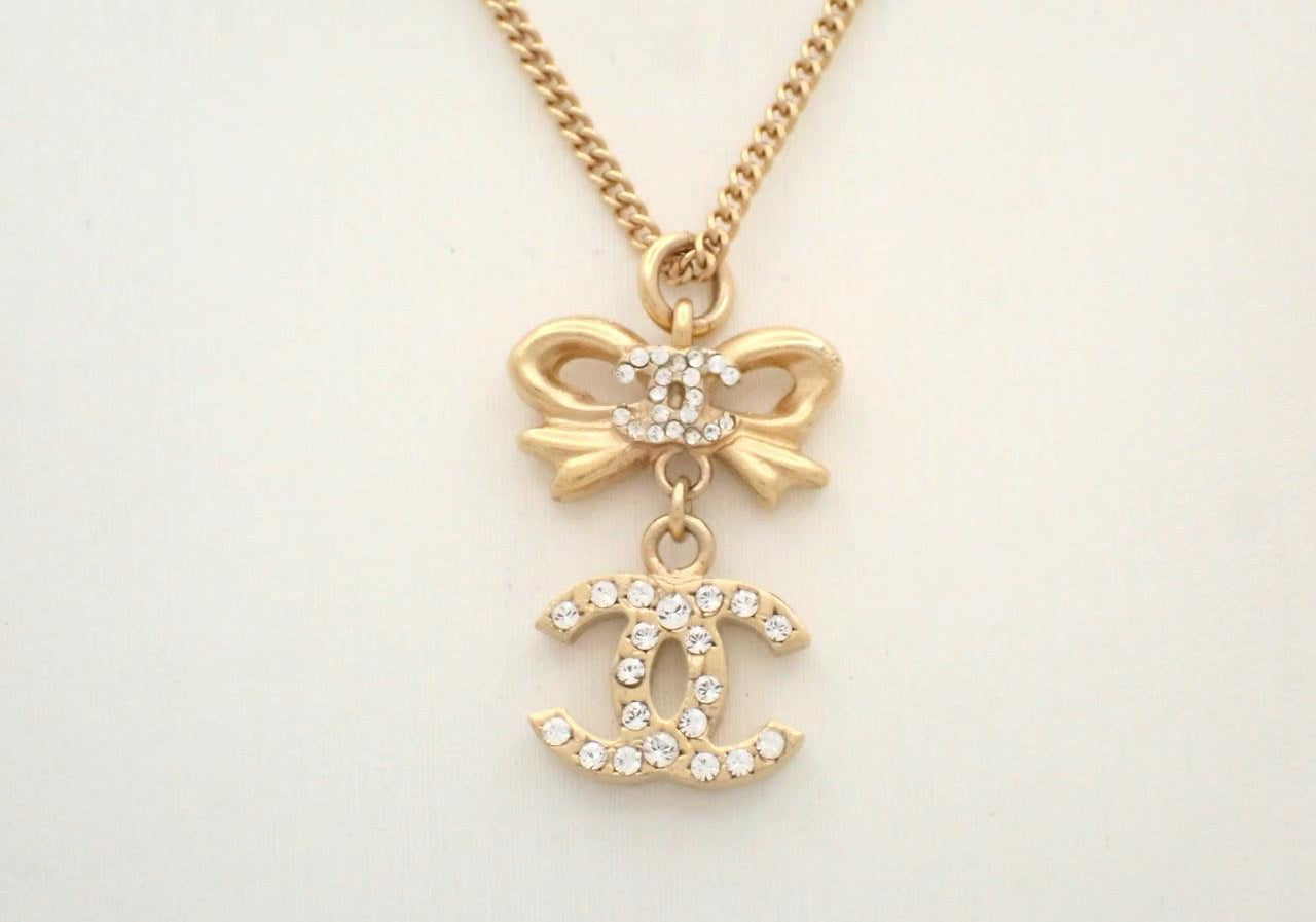 Chanel 2006 Plated Gold Crystal CC Bow Pendant Necklace