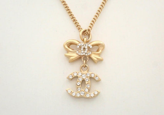 Chanel 2006 Plated Gold Crystal CC Bow Pendant Necklace