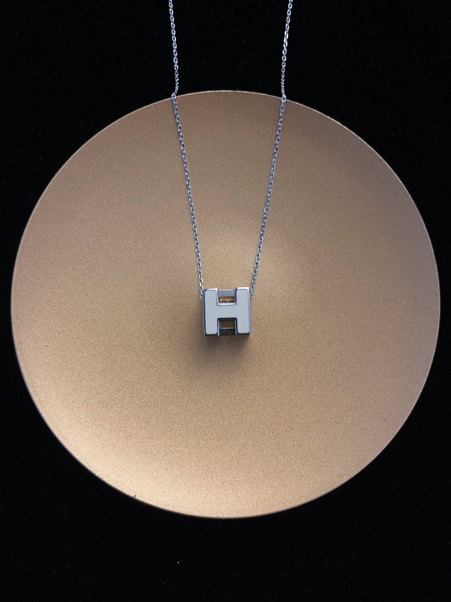 Hermès H Cube Pendant Necklace – White & Silver Tone