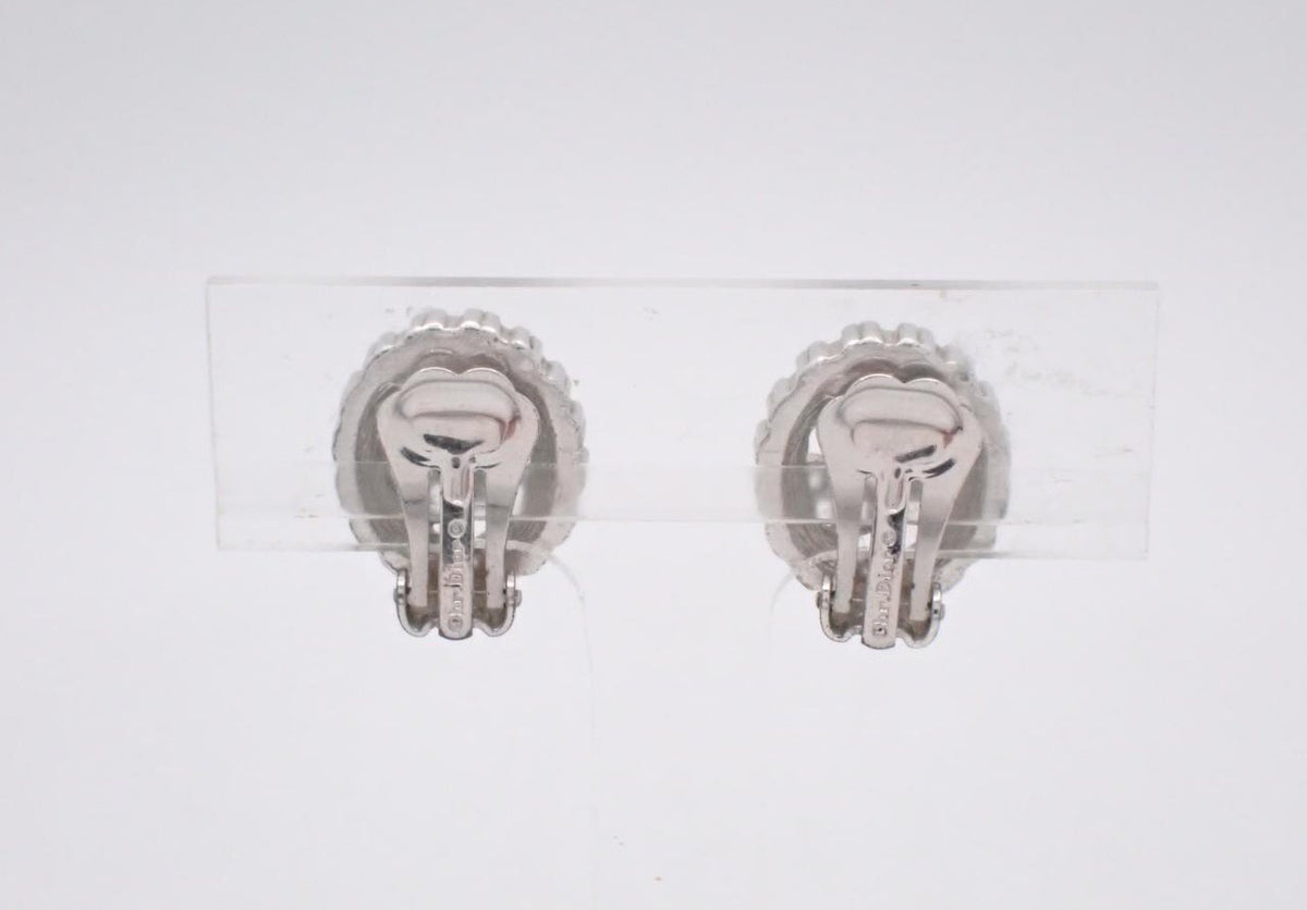 Dior silver oval clip earrings with rhinestone frame and logo