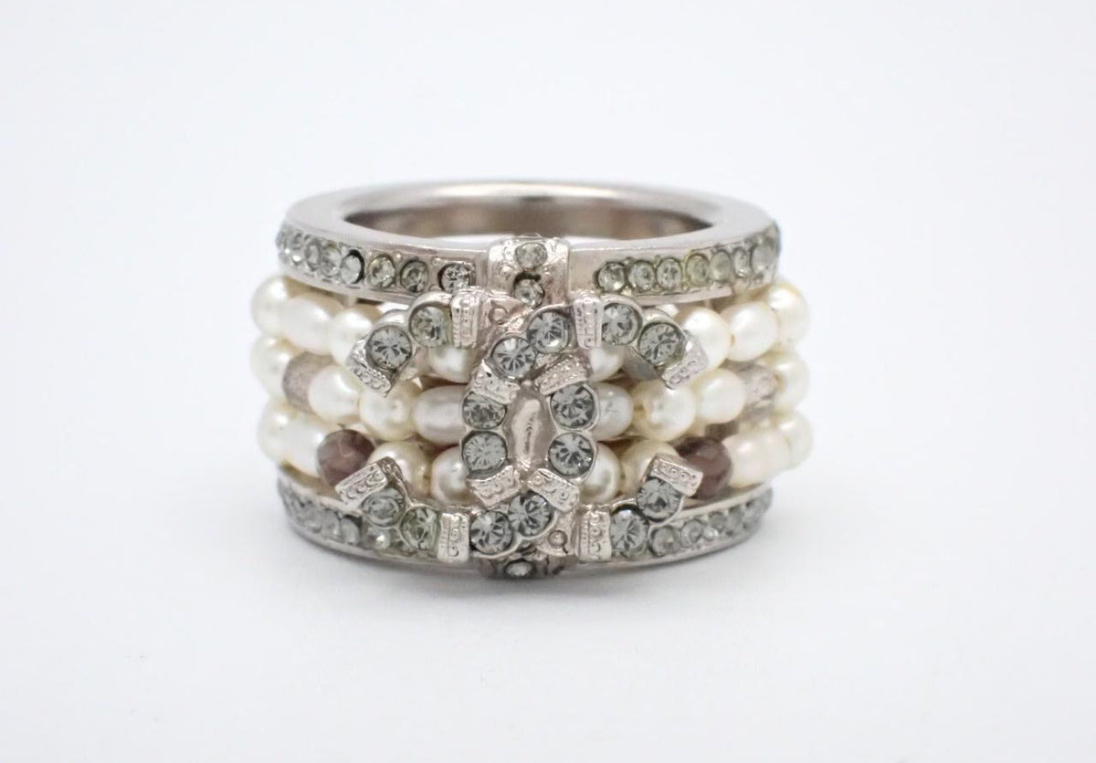 Chanel silver-tone wide band ring with crystal CC logo and white faux pearls