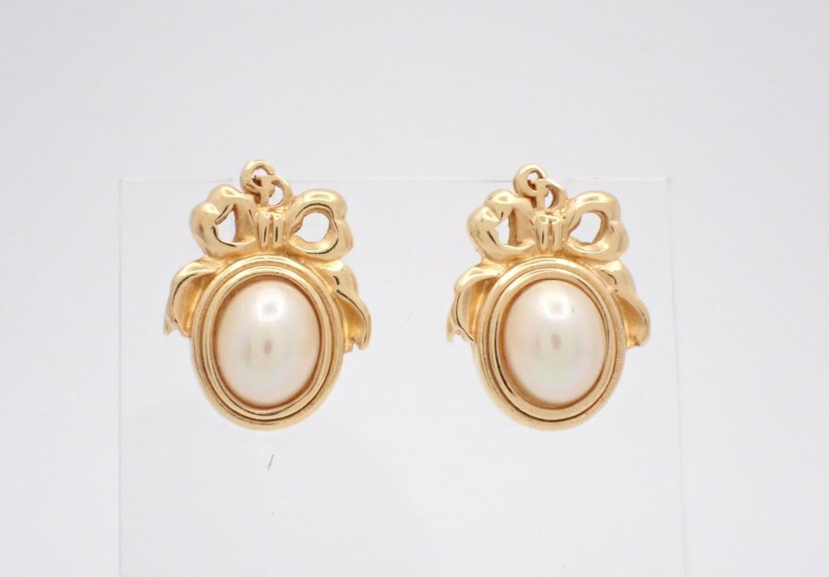 Dior gold-tone stud earrings with faux pearl cabochon and bow motif