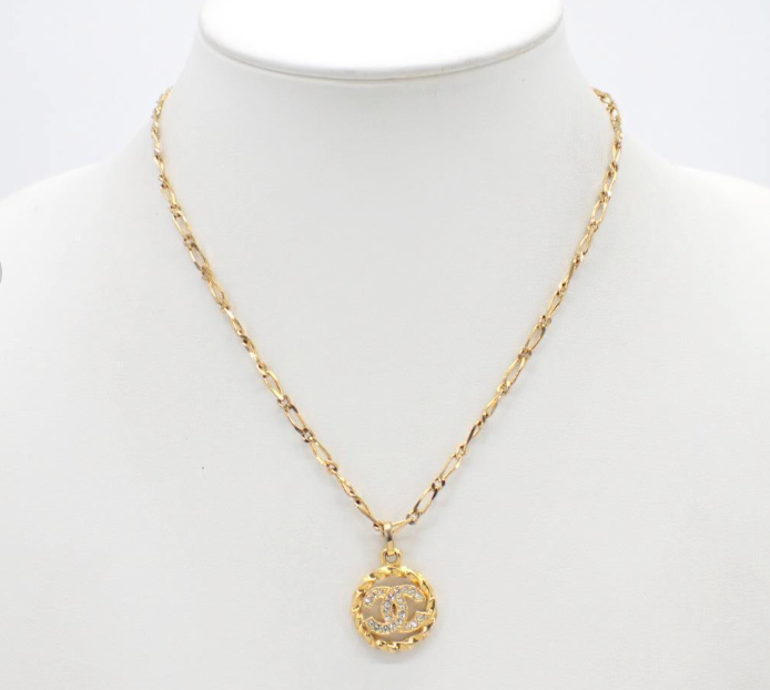 1982 Vintage Chanel Gold-tone chain with round CC medallion pendant featuring crystal accents